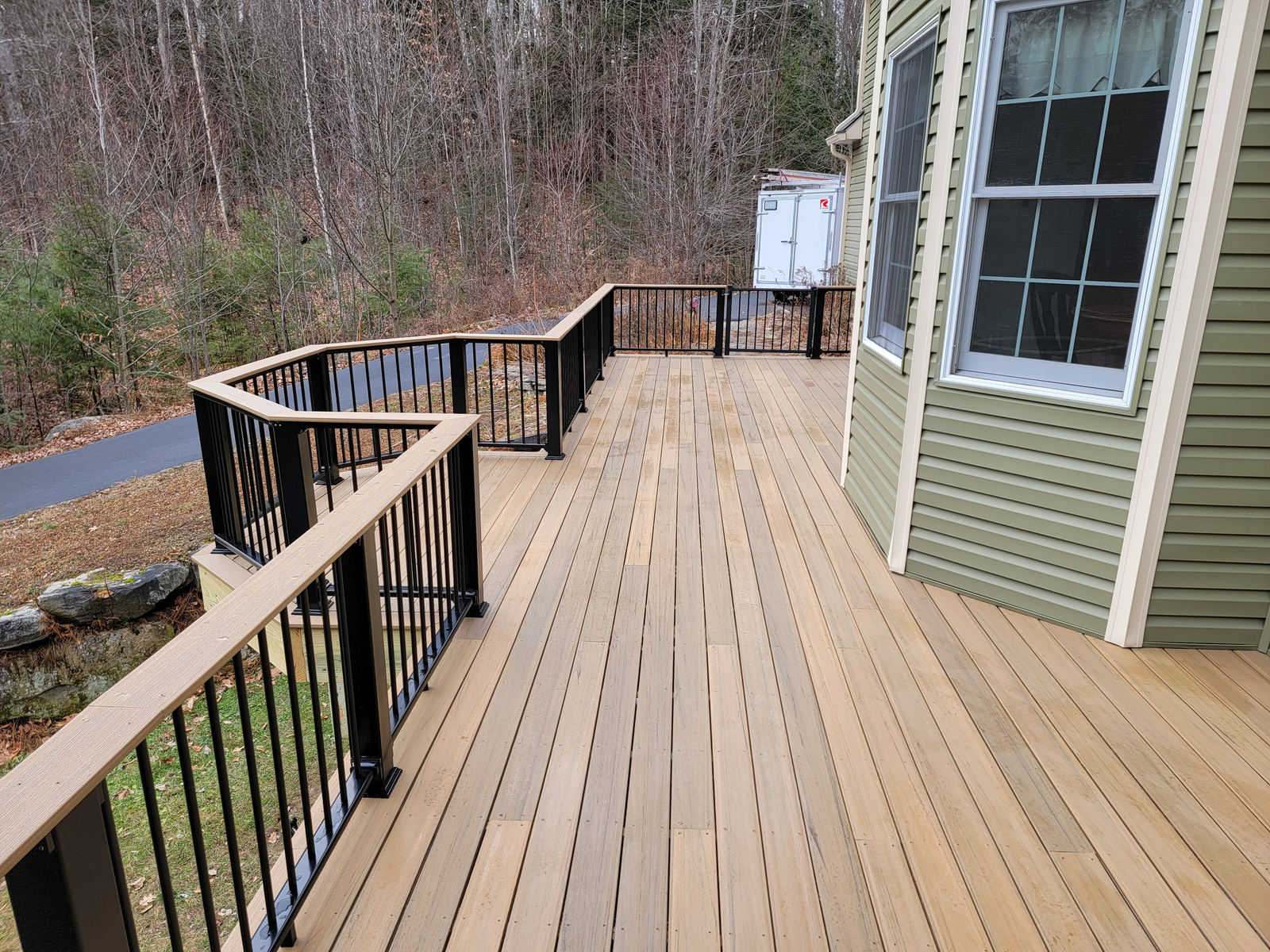 Custom framed deck to ez screen porch with custom decking capped aluminum rail. 