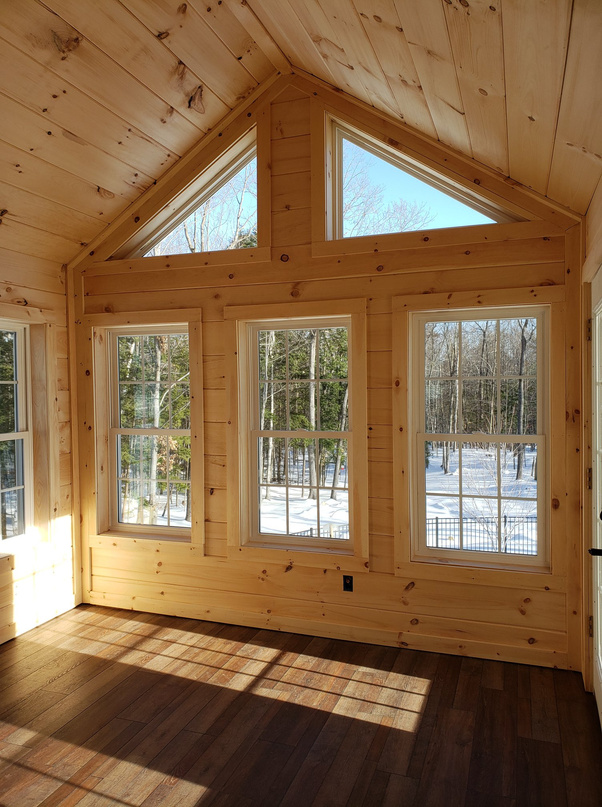 Custom 3 season addition. custom gable end windows with knotty pine finish and waterproof floor. 